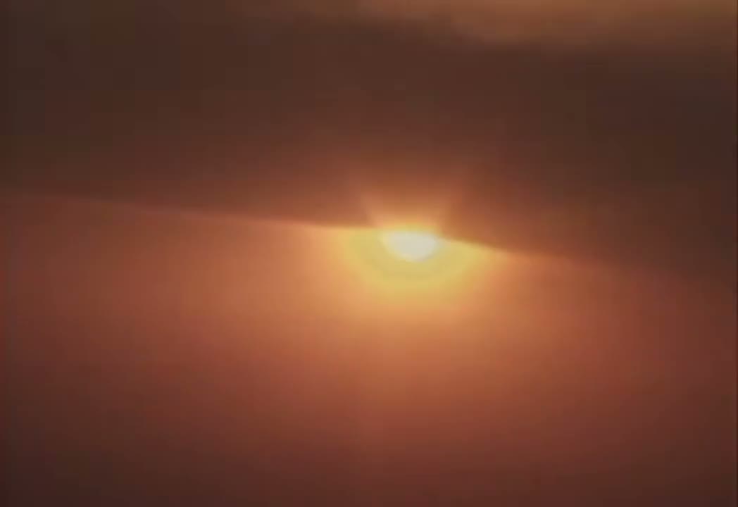 Beach scene from the official Raindance video available in the clip selector